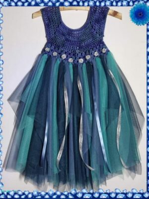 A girls' dress featuring a crocheted bodice in shades of blue and a full tulle skirt in hues of blue for ages 3 to 4 years.